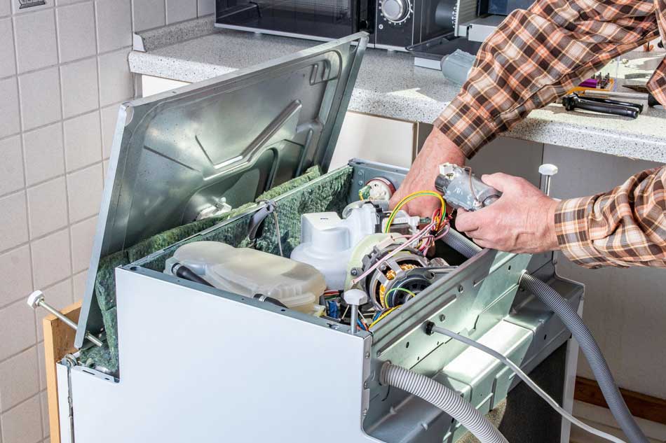 appliance-repair-02 Image of a green plant near a front-loading washing machine with a wooden coffee table holding folded towels, featuring Accurate Appliance Repair and highlighting Dryer & Washer Repair, ensuring it aligns with the page's context.